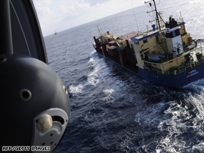 A french navy helicopter watches over a cargo vessel in the Gulf of Aden earlier this year.