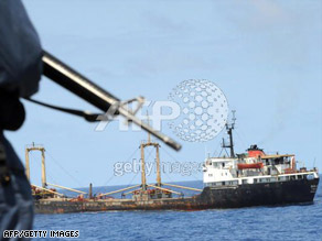 A Canadian naval ship escorts a World Food Programme vessel into Mogadishu, Somalia, on September 18.