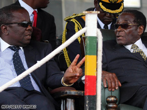 Zimbabwean Prime Minister Morgan Tsvangirai, left, with President Robert Mugabe.