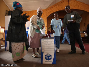 Elderly citizens cast their votes Tuesday in early voting in Alexandra township near Johannesburg.