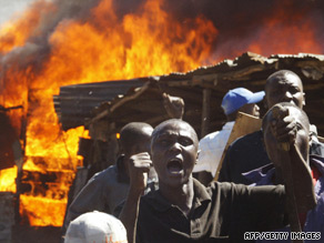 Residents of a Nairobi slum shout during clashes between two rival groups in January 2008.