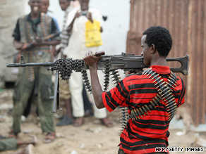 A Somali rebel points a heavy machine gun in the direction of government forces July 3.