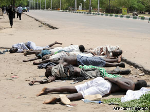 Children who hid in a police office while Islamic radicals took villagers hostage stand in Maiduguri this week.