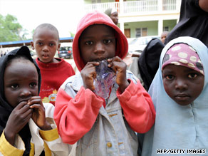 Children who hid in a police office while Islamic radicals took villagers hostage stand in Maiduguri.