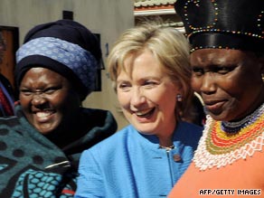 Secretary of State Hillary Clinton poses with residents of South Africa on Saturday during her 11-day trip to Africa.