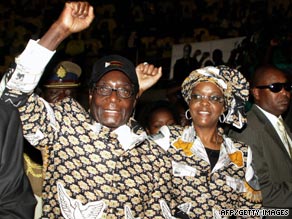 Zimbabwean President Robert Mugabe and his wife Grace arrive for a ZANU PF party youth conference on September 11, 2009