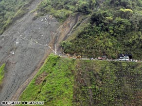 Colombians make their way across a landslide in November after the Nevado del Huila volcano erupted.