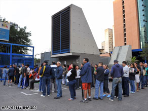 Venezuelans wait to vote on the referendum Sunday at a poll center in Caracas.