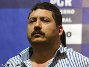 Suspected drug kingpin Hector Huerta Rios faces members of the press Wednesday in Mexico City.