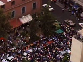 Office workers evacuate buildings in Mexico City, which is particularly vulnerable to quakes.