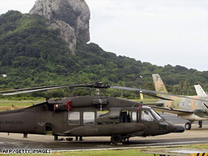 A Brazilian Blackhawk helicopter prepares to depart on another search for wreckage.