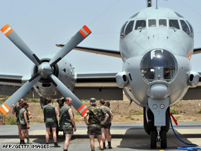 Crew members of a French maritime patrol aircraft prepare Tuesday to search for the missing jet.