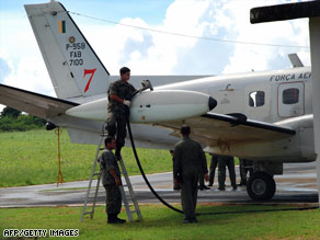 A Brazilian radar plane is fuelled up Monday at the Fernando de Noronha airport to search for Flight 447.
