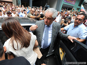 Globovision chief Guillermo Zuloaga gets in a car after a hearing Thursday in Cararas, Venezuela.