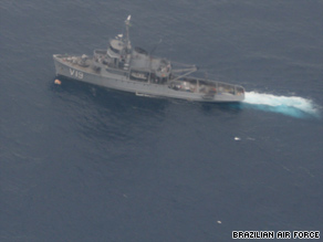 A search vessel steams past a marker and debris in the Atlantic Ocean on Saturday.