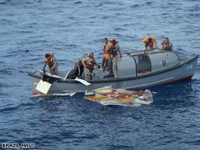 A boat from the Brazilian navy picks up debris in the Atlantic on Sunday.