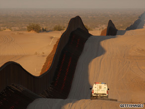 A border patrol vehicle drives along the border between the United States and Mexico on March 14, 2009.