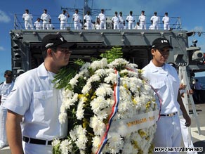 Brazilian Navy officers hold a wreath during a tribute held on Monday to victims of Air France Flight 447.