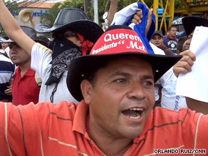 A protester rallies in support of ousted  President Jose Manuel Zelaya on Sunday in Tegucigalpa.