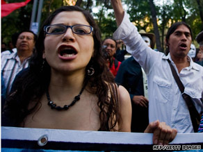 Lucia Morett (L) protests against Colombian President Alvaro Uribe in Mexico City on March 2.