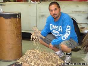 Nick DiMola holds what he believes are about 60 artifacts and pieces of artifacts from Mexico.