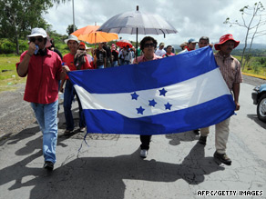 Supporters of Manuel Zelaya march Sunday in support of the ousted Honduras president.
