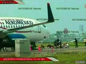 Military personnel surround a hijacked Aeromexico jet after it landed Wednesday in Mexico City.