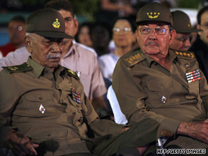 Almeida, left, sits with President Raul Castro on January 1, the 50th anniversary of the Cuban Revolution.
