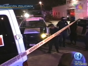 Police gather at the rehab facility where 17 people were killed in Ciudad Juarez, Mexico, in early September.