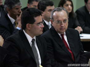 Former Costa Rican President Rafael Calderon, right, listens to his sentence on Monday in a San Jose court.