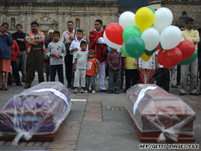 Empty coffins sit in Bolivar Square in Bogota, Colombia, last month during a protest against the killings.