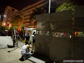Police erect a barrier outside the offices of Luz y Fuerza del Centro in Mexico City.