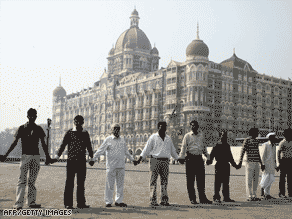 People hold a demonstration of solidarity outside Mumbai's Taj hotel in mid-December.