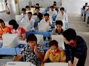 Farmers in China learn how to use the Internet in April 2008 in Guangdong province.