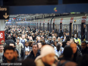 Don't you wish you had stayed home instead? Commuters at the Gare du Nord train station in Paris.