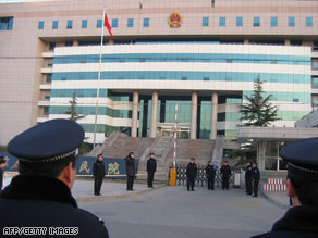 Chinese police surround a court building in Shijiazhuang, Hebei province on December 31, 2008, during the trial.