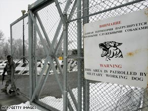 A U.S. troop guards the main access checkpoint to the Manas Air Base on December 18, 2008.