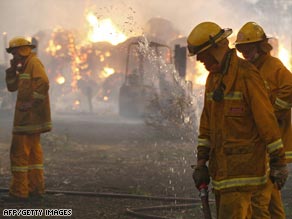 Firefighters battle a blaze in Labertouche, about 125 kilometers west of Melbourne.