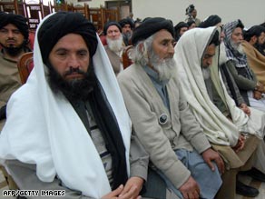 Delegation members of pro-Taliban leader Soofi Mohammad at a meeting in Peshawar Monday.