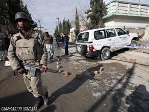 A soldier stands guard where John Solecki was kidnapped in Quetta, Pakistan, in early February.