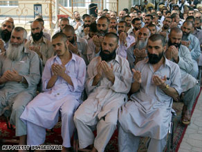 Former detainees pray near Kaubul in 2005 following their release from U.S. custody at Bagram Air Base.