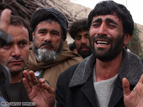 An Afghan man grieves for his brother after an attack this week by U.S.-led coalition forces.