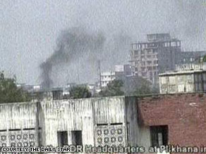 Plumes of smoke billow into the air after a gunbattle in the Bangladesh Rifles headquarters in Dhaka.