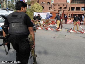 A police commando carries a rocket launcher believed to be used in the attack on the Sri Lankan players.