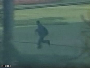 A video grab shows a suspected gunman near Gaddafi Stadium in Lahore, Pakistan, Tuesday.