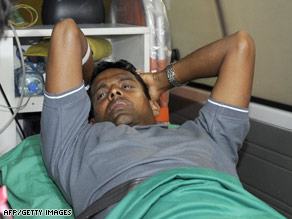 Sri Lankan player Thilan Samaraweera is taken aboard an ambulance Wednesday in Colombo.