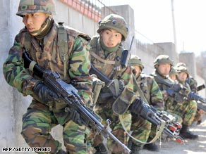 South Korean soldiers move into a building during a joint military exercise with U.S. troops in Pocheon Tuesday.