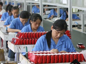 Workers assemble toys on a production line at a factory in Shantou, in China's Guangdong province.