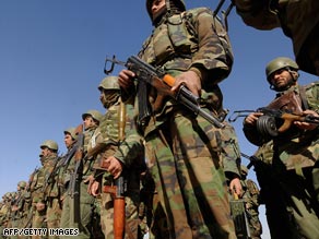 Afghan National Army (ANA) soldiers listen to a speach in Nadi Ali district, Helmand province, on February 5, 2009.