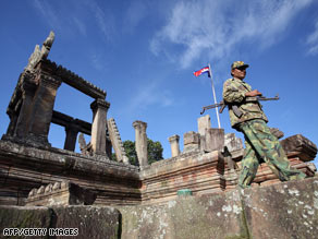 A Cambodian soldier walks past Preah Vihear temple in the Cambodian province of Preah Vihear on July 21.